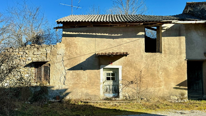 Ruin with building permit surrounded by nature